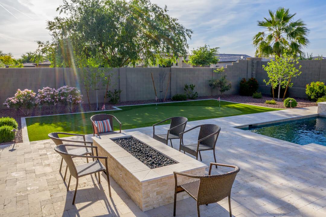 Backyard remodel with fire pit and seating area Phoenix