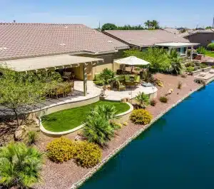 Backyard with river view artificial turf installation