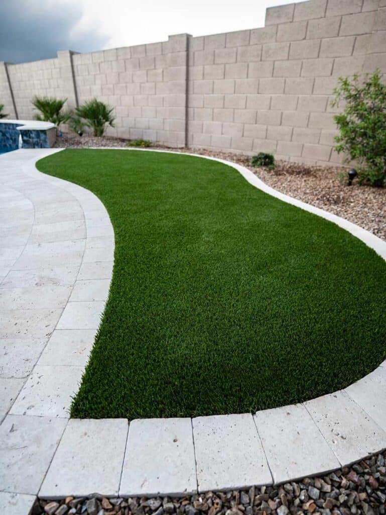 Turf install in backyard landscape project