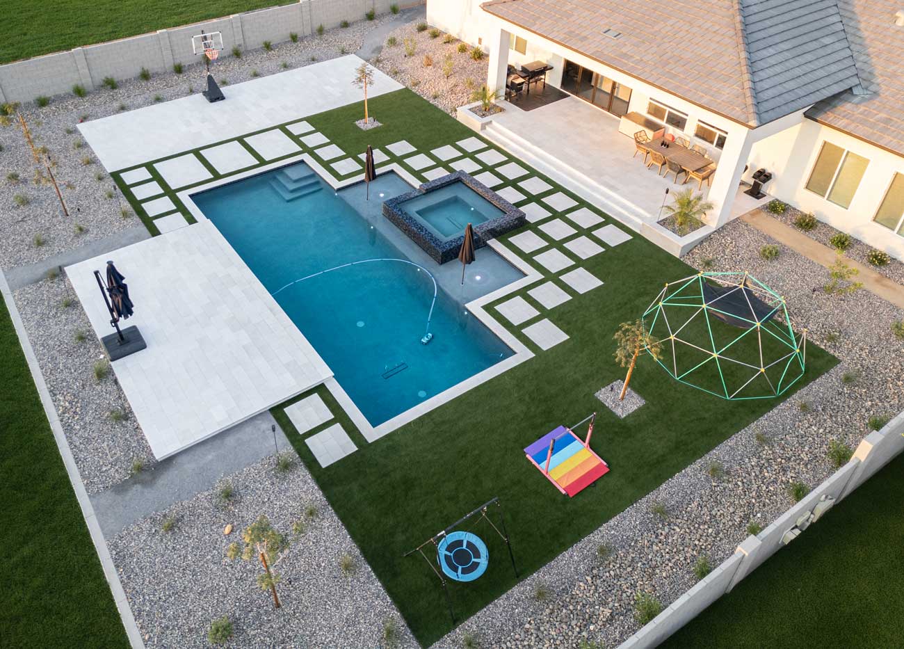 Artificial turf backyard with floating pavers, pool and spa, Queen Creek AZ